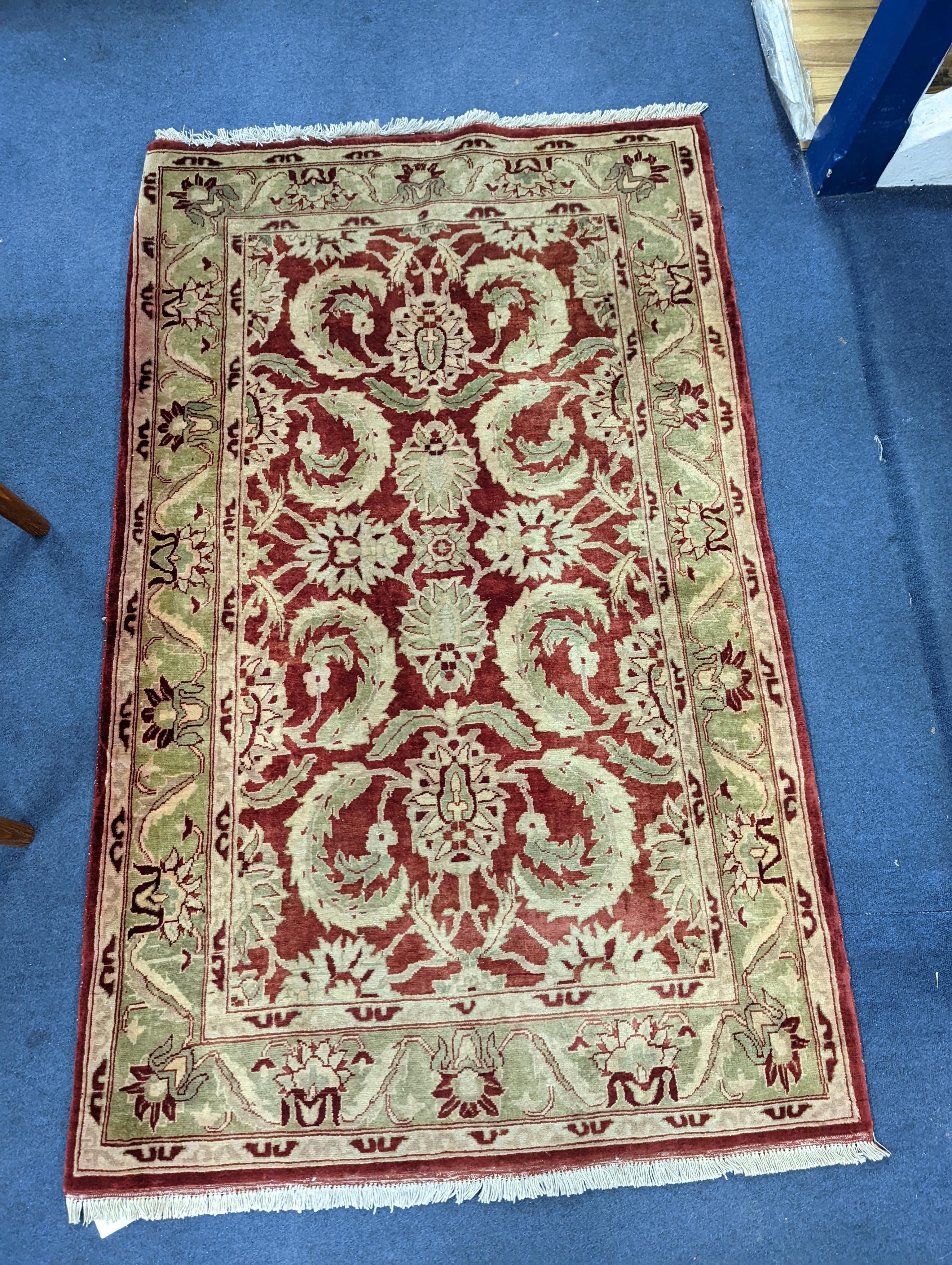 A Zeigler red ground rug, 160 x 100cm